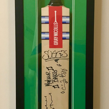 Madness signed cricket bat
